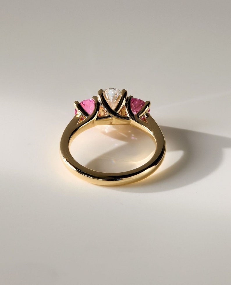 2ct oval Lab-Grow Diamond & Pink Each 0.75ct lab Grow Three-Stone Ring in 14K Yellow Gold