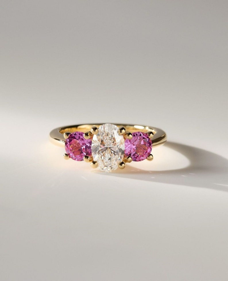 2ct oval Lab-Grow Diamond & Pink Each 0.75ct lab Grow Three-Stone Ring in 14K Yellow Gold