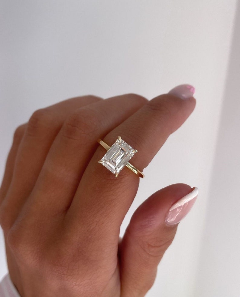 3ct Emerald-Cut Lab Grown Solitaire Diamond Ring in 14k Yellow Gold IGI Certified.