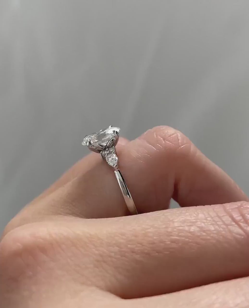 3.50ct Oval Cut Lab-Grown Diamond Cluster Engagement Ring in White Gold on Side Pear Shape Each 0.50ct.